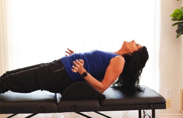 Eileen Durfee demonstrating a spinal bridge exercise for mobility