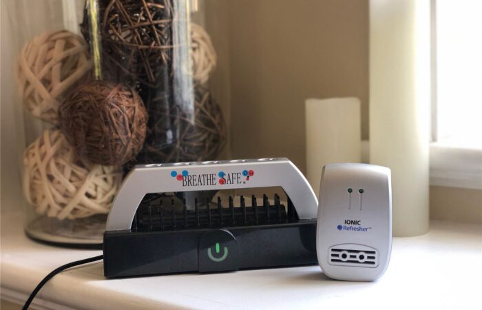 Breathe Safe plasma air purifier and Ionic Refresher on a bedroom table