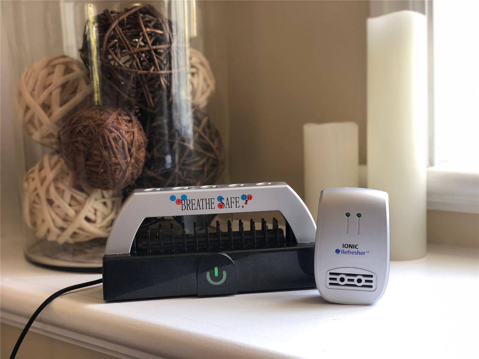Breathe Safe plasma air purifier and Ionic Refresher on a bedroom table