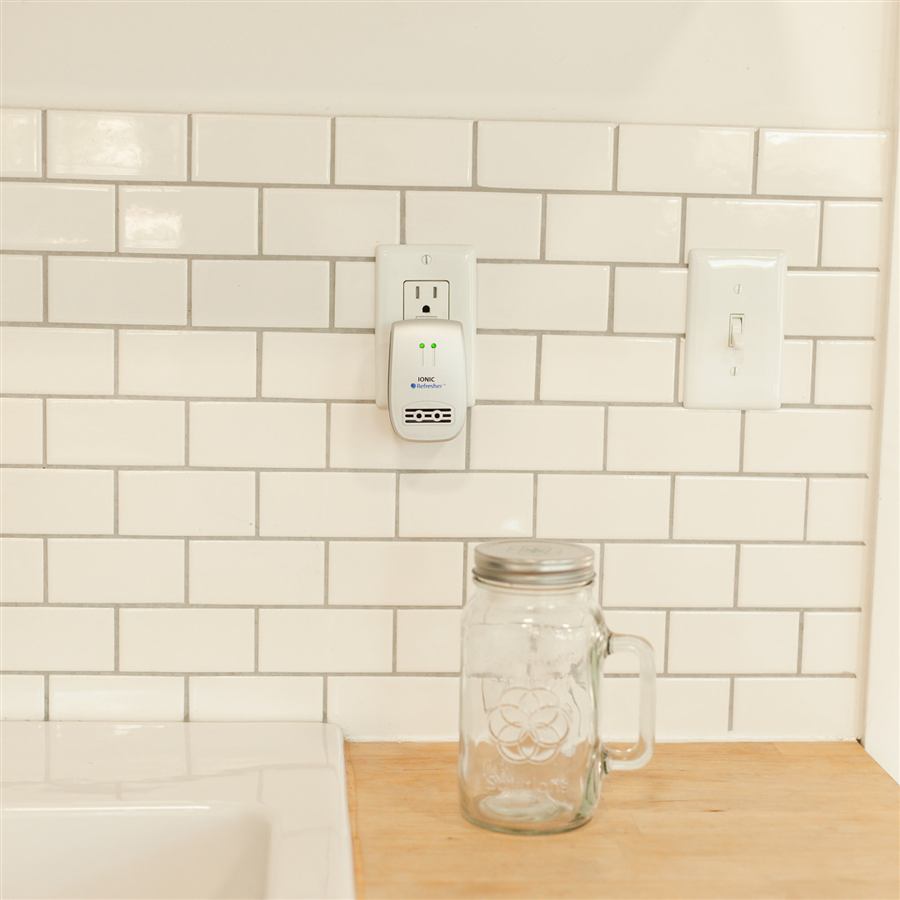 Breathe Safe plasma air purifier plugged in at a home kitchen