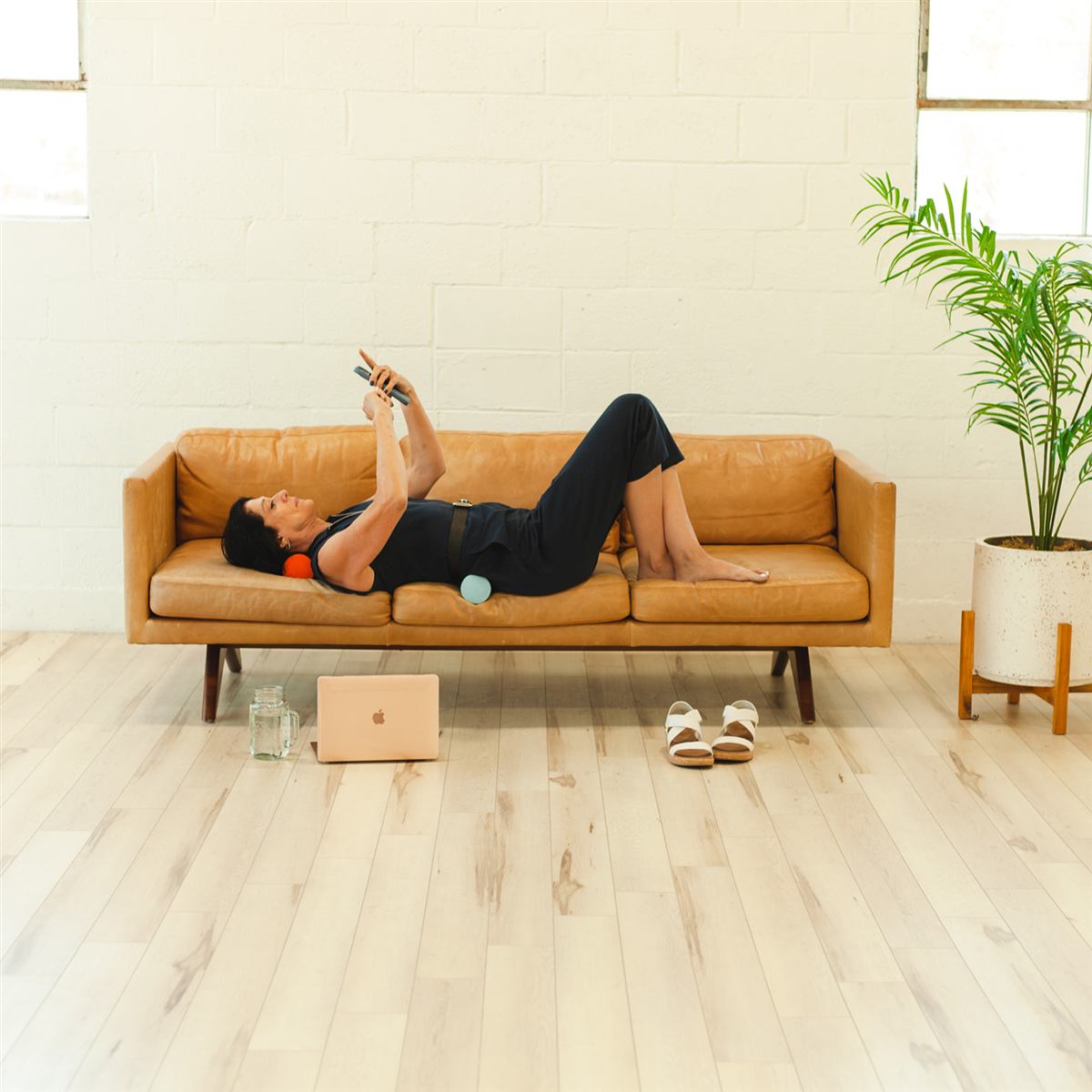 Eileen Durfee relieving back pain with a Creatrix spinal foam roll