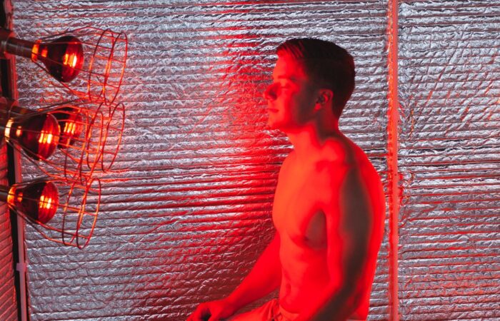 Evening near infrared sauna session in the warm glow of the Sauna Fix lamp