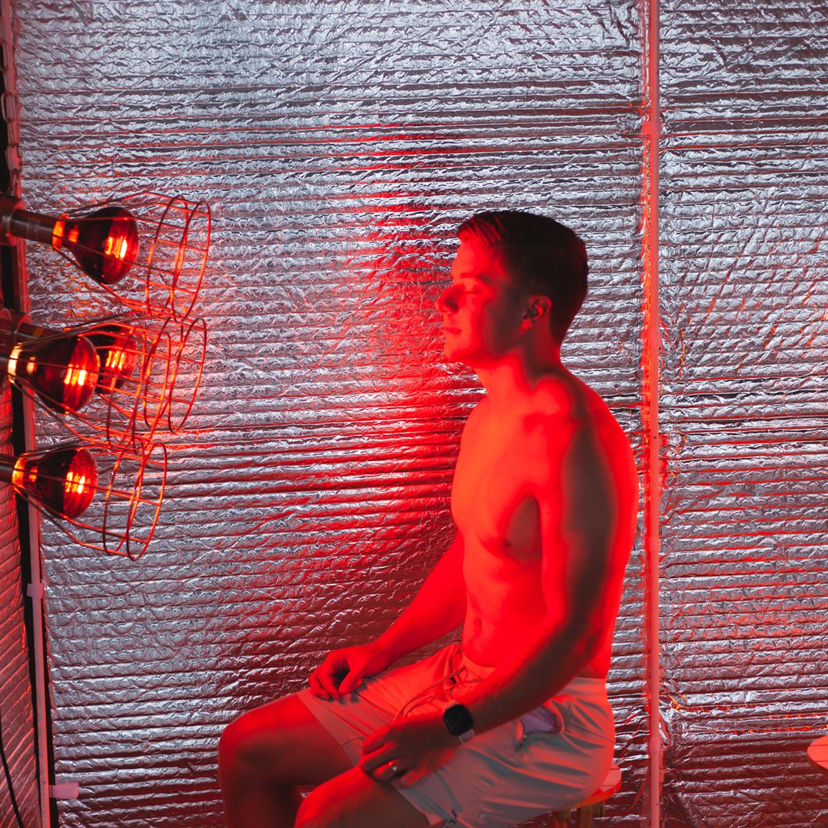 Evening near infrared sauna session in the warm glow of the Sauna Fix lamp