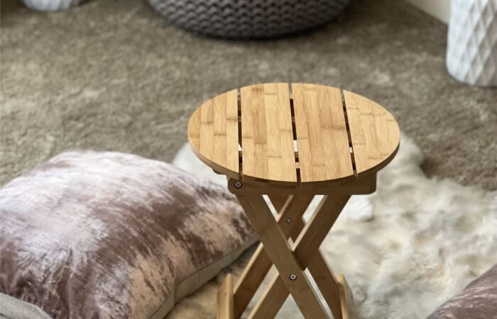 A home recovery corner with bamboo folding stool and organic fleece rug