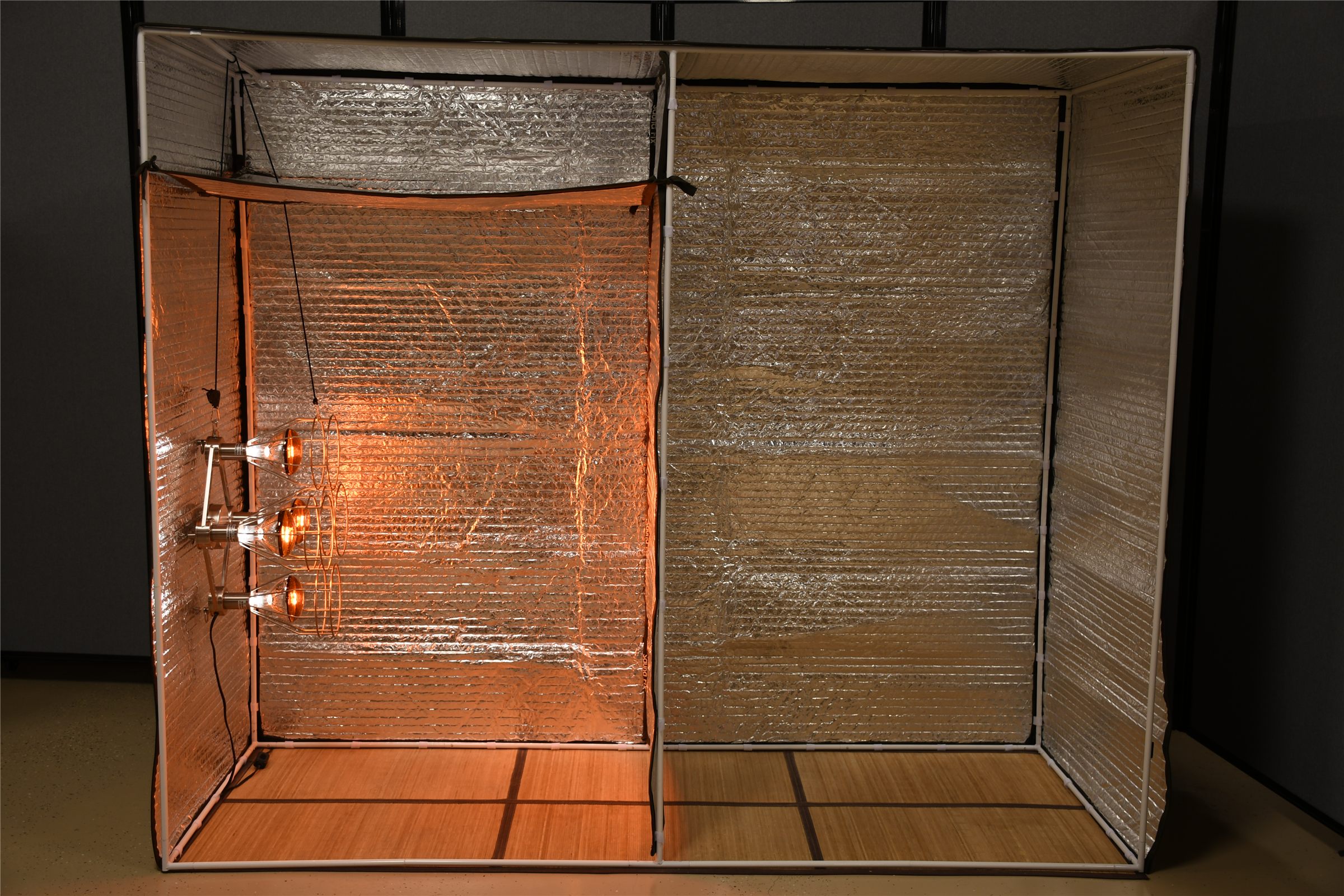Near infrared lamps glowing inside the Sauna Fix radiant tent