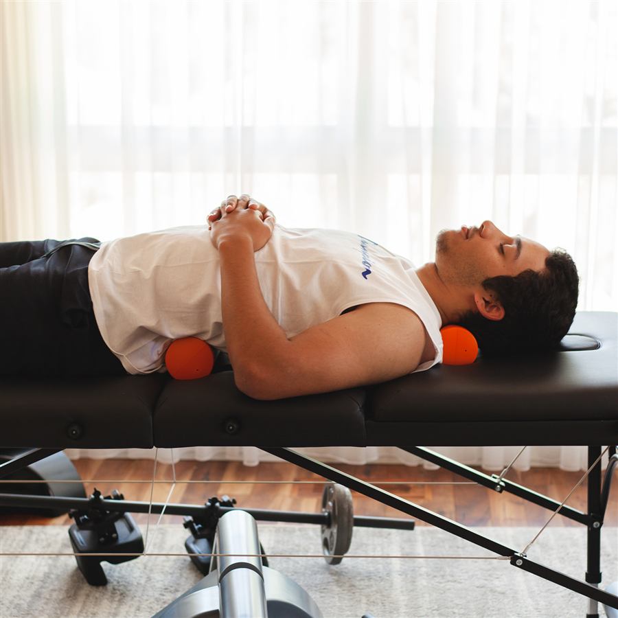 Neck and Back Shaper rolls supporting the spine during supported rest