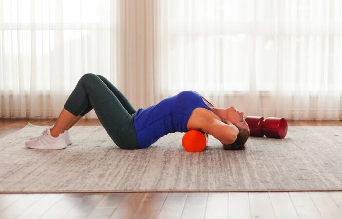 Spinal extension exercise over a firm foam roll