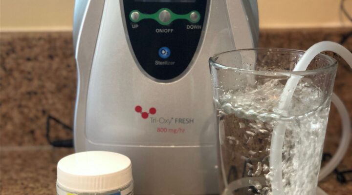 Tri-Oxy FRESH with a glass of water and Healthy Salt minerals on the counter